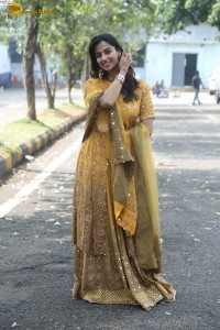 Indian actress meenakshi chaudhary in a yellow dress