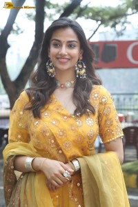 Indian actress meenakshi chaudhary in a yellow dress