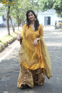 Indian actress meenakshi chaudhary in a yellow dress