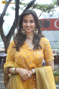 Indian actress meenakshi chaudhary in a yellow dress