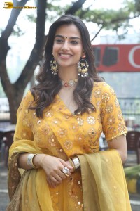 Indian actress meenakshi chaudhary in a yellow dress