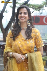 Indian actress meenakshi chaudhary in a yellow dress