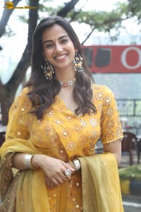 Indian actress meenakshi chaudhary in a yellow dress