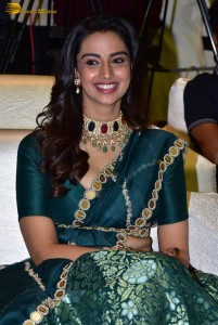 Meenakshi Chaudhary gorgeous in a green saree at a movie function