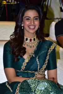 Meenakshi Chaudhary gorgeous in a green saree at a movie function