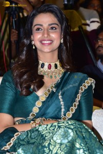 Meenakshi Chaudhary gorgeous in a green saree at a movie function