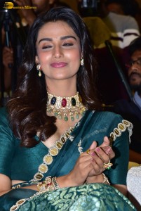 Meenakshi Chaudhary gorgeous in a green saree at a movie function