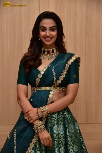 Meenakshi Chaudhary gorgeous in a green saree at a movie function