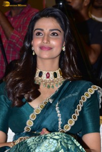 Meenakshi Chaudhary gorgeous in a green saree at a movie function
