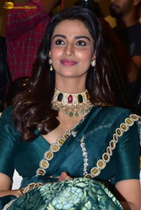 Meenakshi Chaudhary gorgeous in a green saree at a movie function