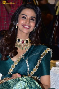 Meenakshi Chaudhary gorgeous in a green saree at a movie function