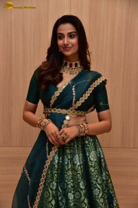 Meenakshi Chaudhary gorgeous in a green saree at a movie function