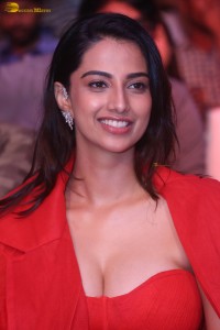 actress Meenakshi Chaudhary red hot looks in a red dress at SIIMA event