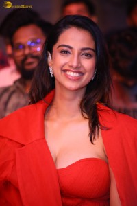 actress Meenakshi Chaudhary red hot looks in a red dress at SIIMA event