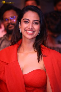 actress Meenakshi Chaudhary red hot looks in a red dress at SIIMA event