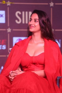actress Meenakshi Chaudhary red hot looks in a red dress at SIIMA event