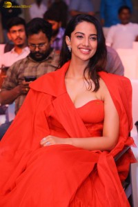 actress Meenakshi Chaudhary red hot looks in a red dress at SIIMA event