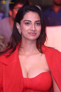 actress Meenakshi Chaudhary red hot looks in a red dress at SIIMA event