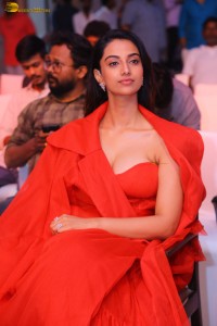 actress Meenakshi Chaudhary red hot looks in a red dress at SIIMA event