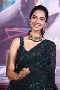 actress Meenakshi Chaudhary gorgeous in a green saree attending an event