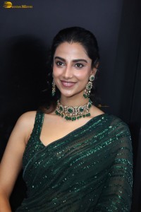 actress Meenakshi Chaudhary gorgeous in a green saree attending an event