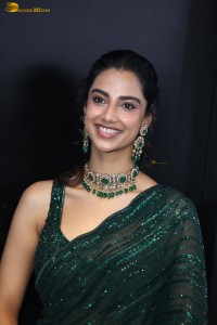 actress Meenakshi Chaudhary gorgeous in a green saree attending an event