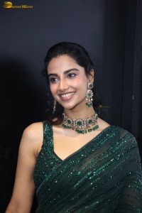 actress Meenakshi Chaudhary gorgeous in a green saree attending an event