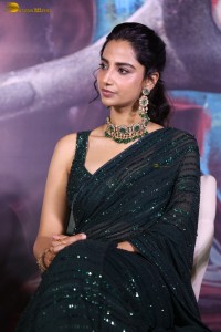 actress Meenakshi Chaudhary gorgeous in a green saree attending an event