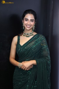 actress Meenakshi Chaudhary gorgeous in a green saree attending an event
