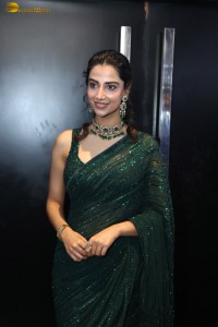 actress Meenakshi Chaudhary gorgeous in a green saree attending an event