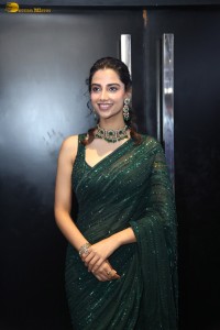 actress Meenakshi Chaudhary gorgeous in a green saree attending an event