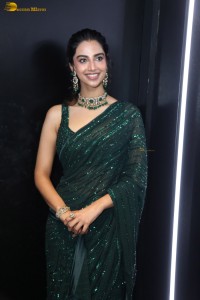 actress Meenakshi Chaudhary gorgeous in a green saree attending an event