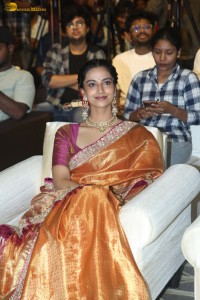 Indian actress Meenakshi Chaudhary dazzles in a yellow gold color saree at a function