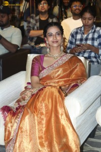 Indian actress Meenakshi Chaudhary dazzles in a yellow gold color saree at a function