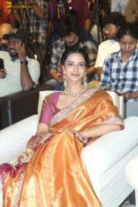 Indian actress Meenakshi Chaudhary dazzles in a yellow gold color saree at a function