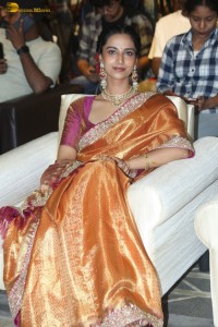 Indian actress Meenakshi Chaudhary dazzles in a yellow gold color saree at a function