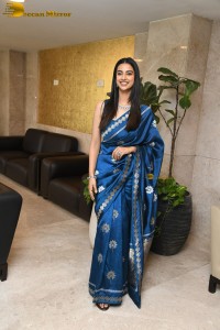 actress Meenakshi Chaudhary dazzles in a blue saree at a function