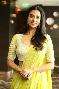 actress Meenakshi Chaudhary beautiful in a yellow saree