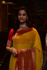 Indian Actress Meenakshi Chaudhary in a yellow saree