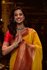 Indian Actress Meenakshi Chaudhary in a yellow saree