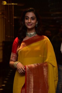 Indian Actress Meenakshi Chaudhary in a yellow saree