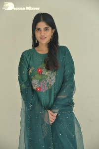 Actress Megha Akash posing for pictures in a green salwar kameez