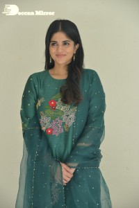 Actress Megha Akash posing for pictures in a green salwar kameez