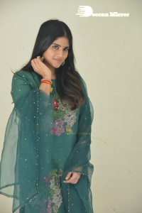 Actress Megha Akash posing for pictures in a green salwar kameez
