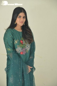 Actress Megha Akash posing for pictures in a green salwar kameez