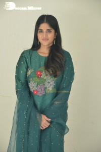 Actress Megha Akash posing for pictures in a green salwar kameez