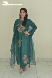 Actress Megha Akash posing for pictures in a green salwar kameez