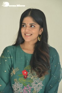 Actress Megha Akash posing for pictures in a green salwar kameez