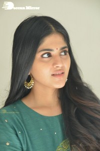 Actress Megha Akash posing for pictures in a green salwar kameez