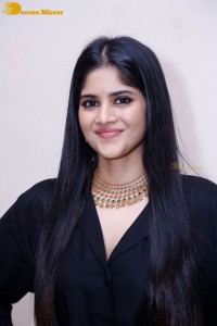 Actress Megha Akash in a black dress